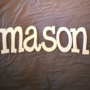 Wooden Letters that spell mason, white, wood